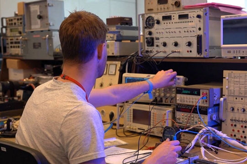 AIR TEAM avionics technician at the test bench in the Part-145 workshop